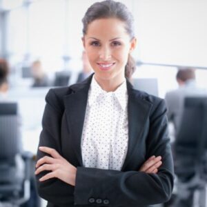 Attractive young businesswoman standing confidently in the office - portrait